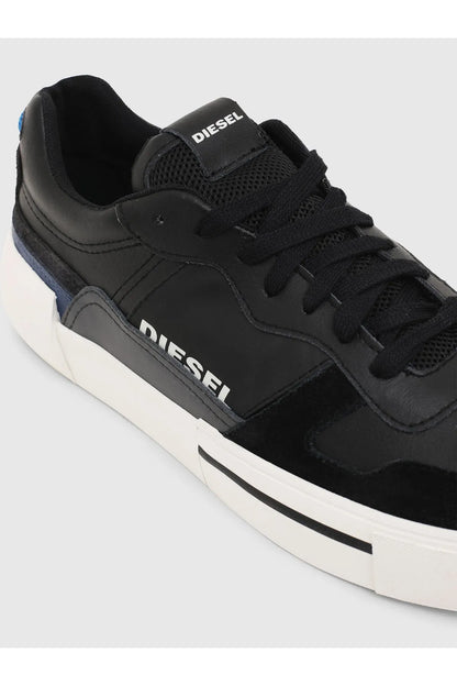Black Diesel low-top sneakers, side view with lace-up eyelets and blue accents