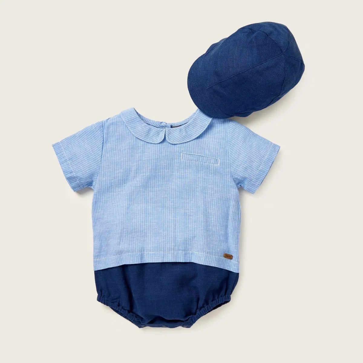 Light blue striped baby romper with navy shorts and matching fabric hat