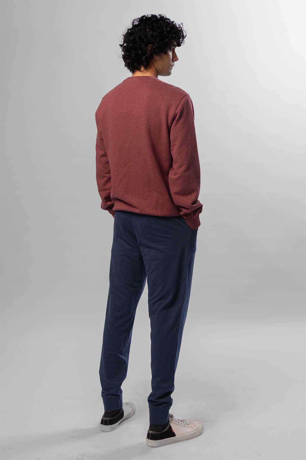 Levi's crewneck sweatshirt and dark blue jeans, maroon long sleeves, back view