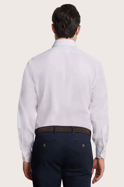 Back view of men's white button-up dress shirt with long sleeves
