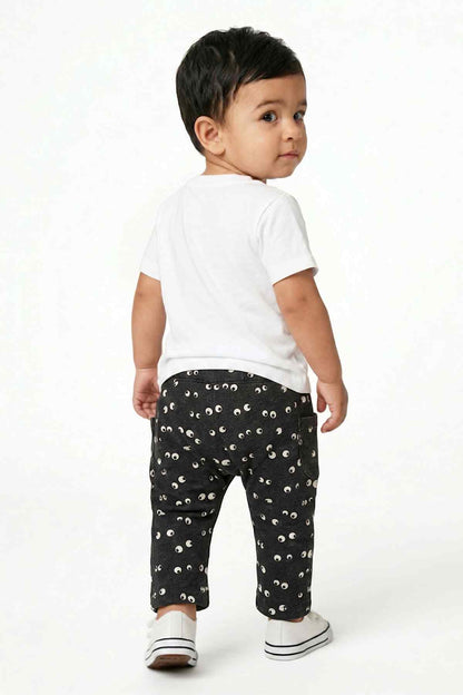 Dark navy baby pants with white eye print and elastic waist