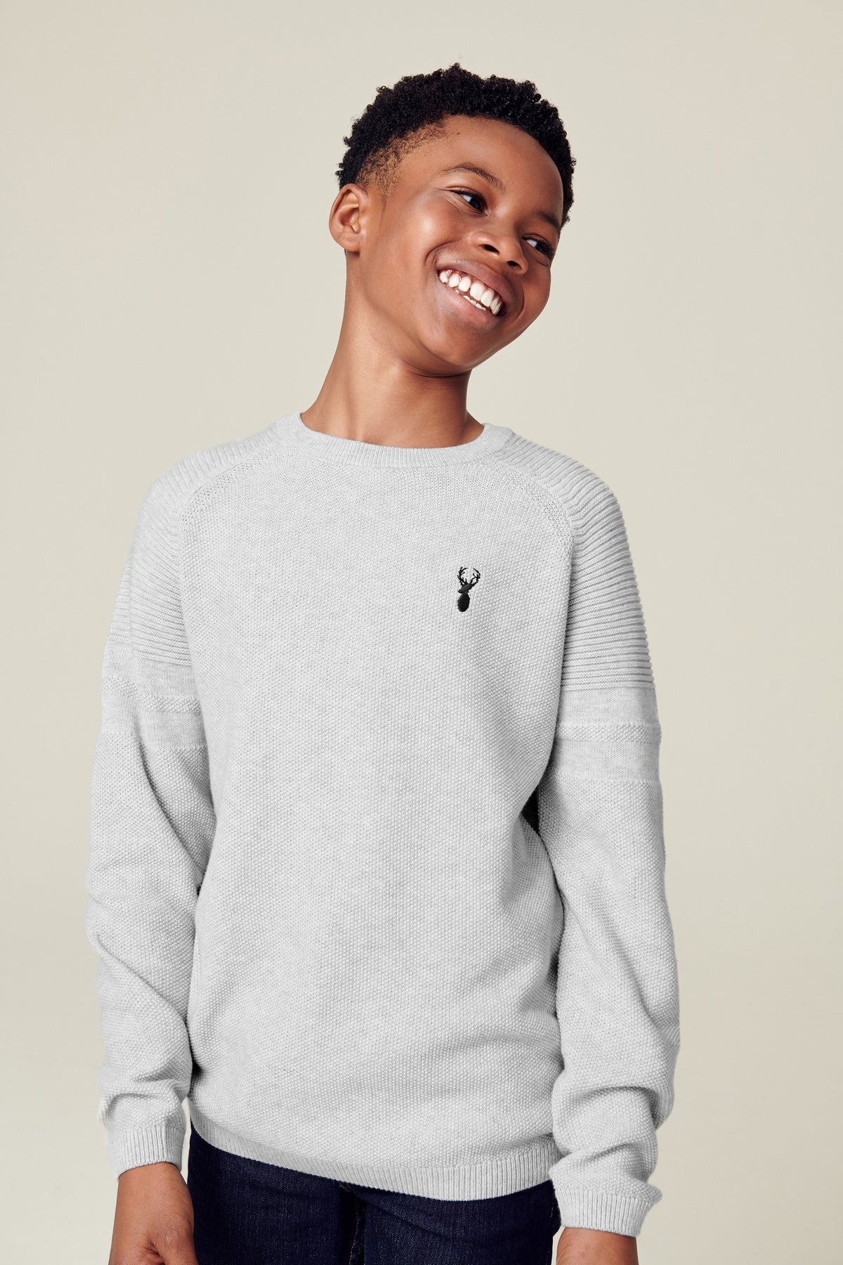 Grey crewneck knit sweater with small embroidered logo on chest