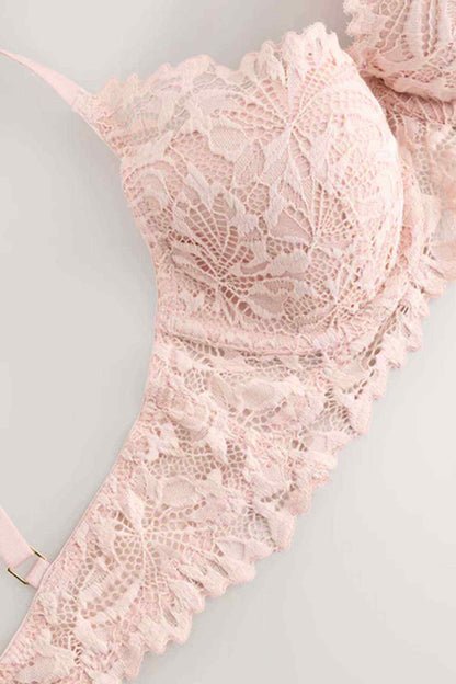 Light pink lace bra cup with floral lace pattern and thin adjustable strap