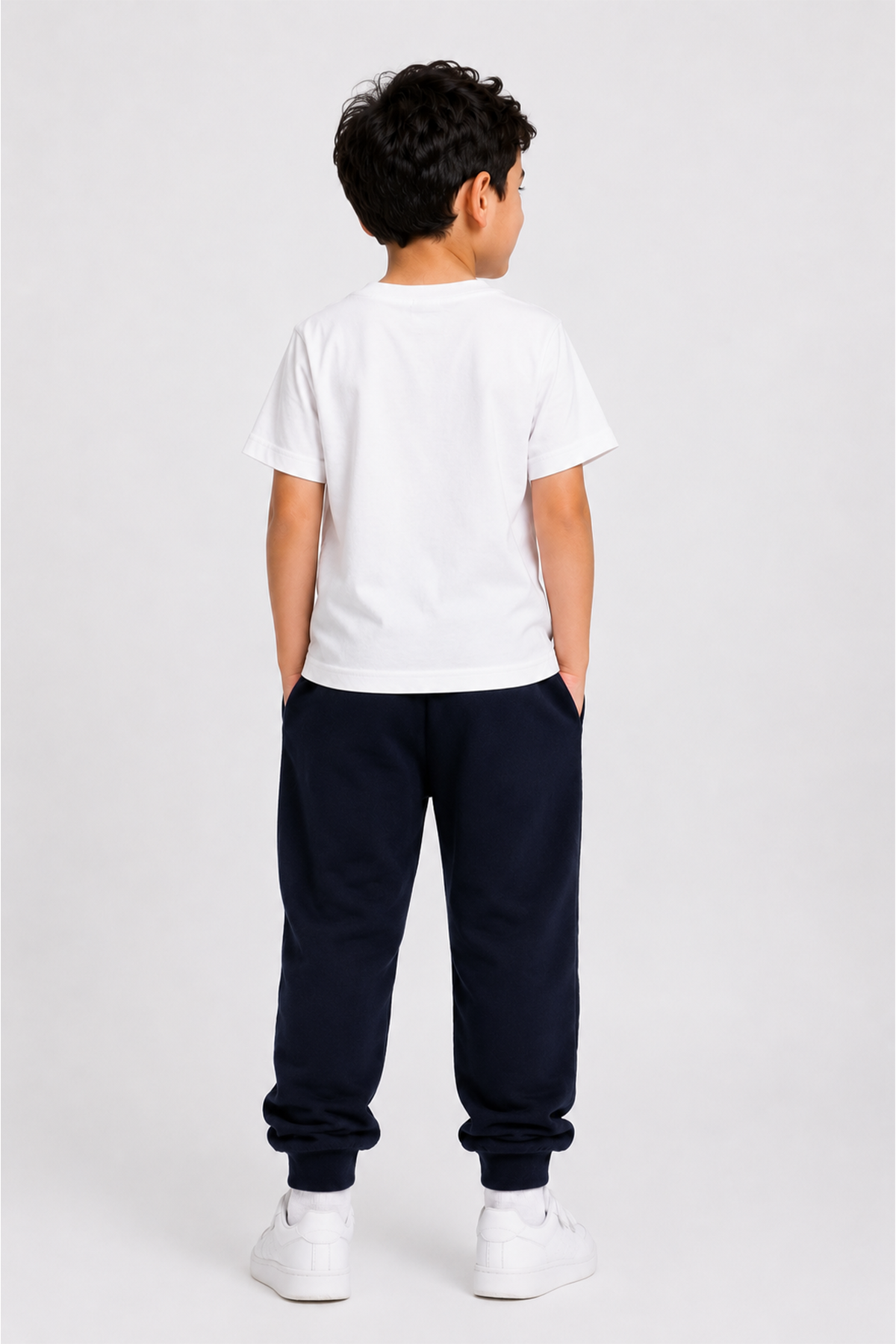 Boys white T-shirt and navy jogger pants set, back view with elastic waist and cuffs.