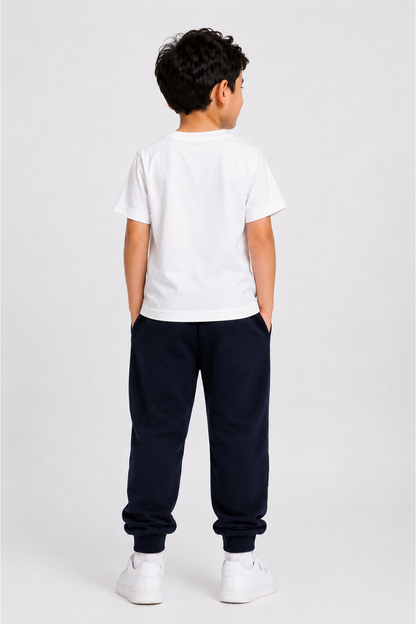 Boys white T-shirt and navy jogger pants set, back view with elastic waist and cuffs.
