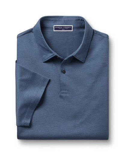 Blue polo shirt folded, buttoned neckline with brand label