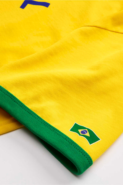 Yellow T-shirt sleeve cuff with green trim and Brazil flag patch