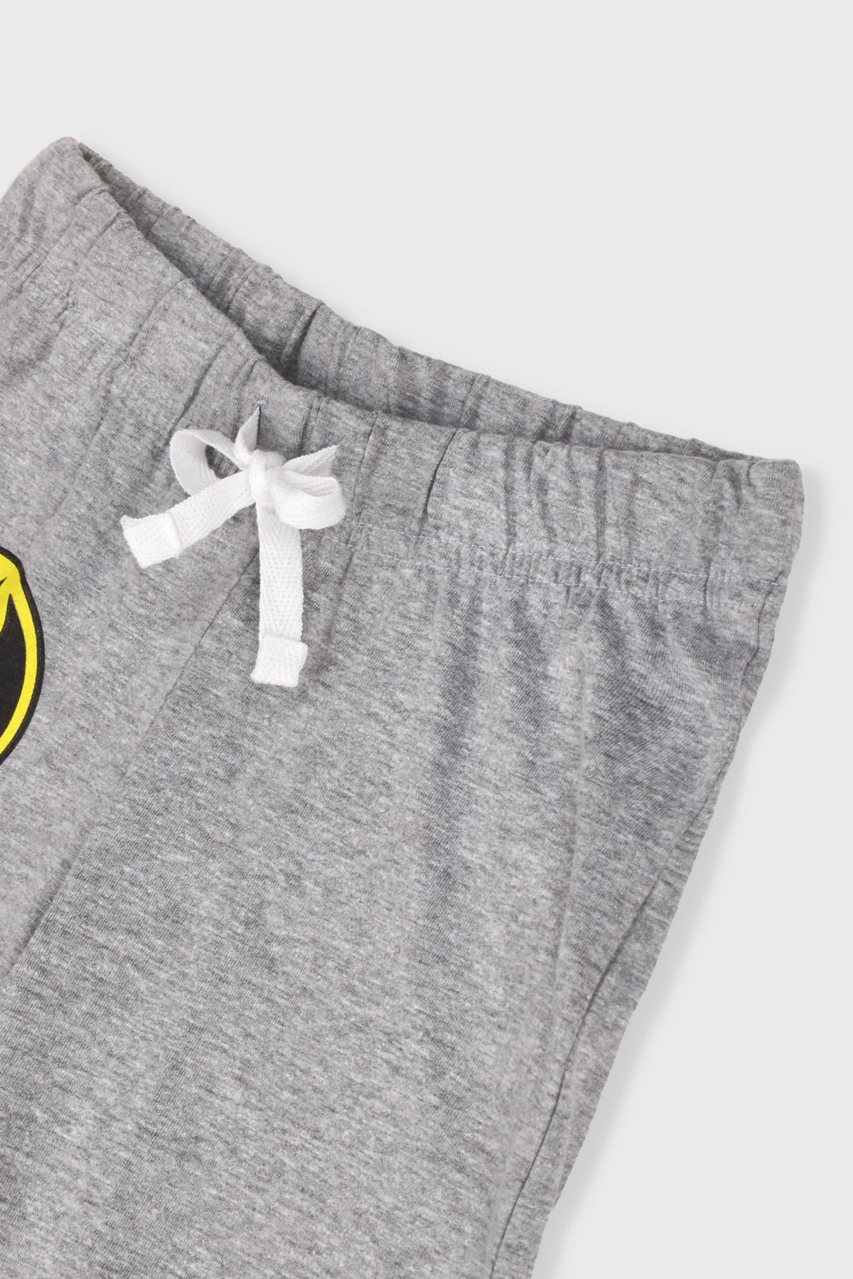 Kids' gray shorts with white ribbon tie, Batman logo partially visible at left
