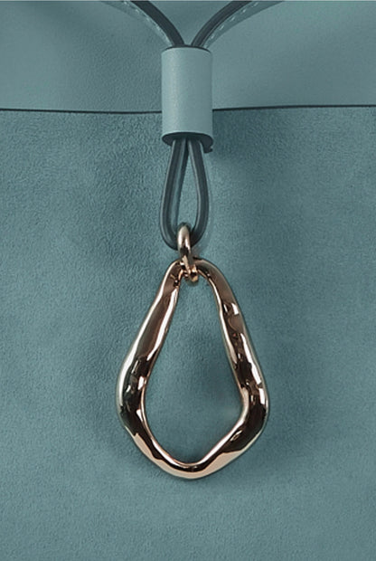 Luella blue tote bag close-up of hanging teardrop key charm