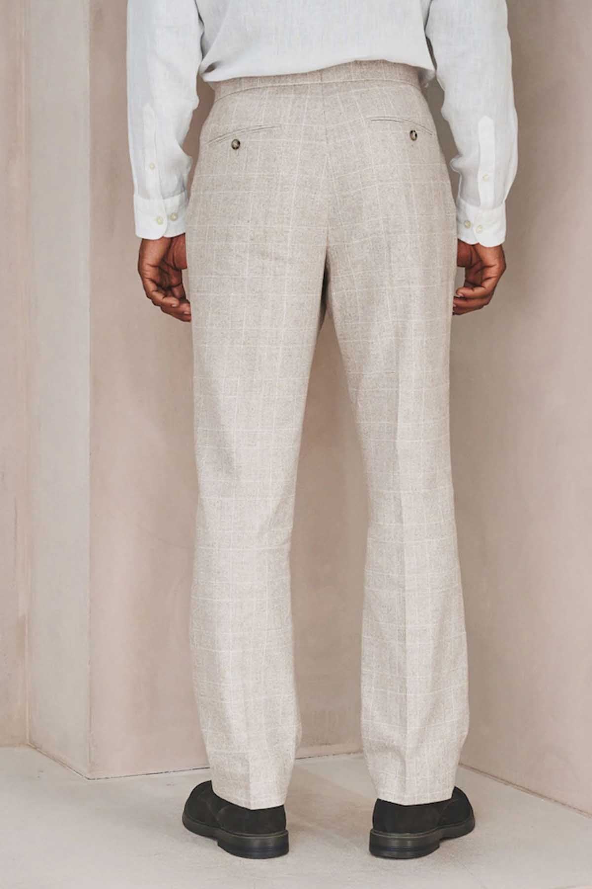 Men's light beige suit trousers with pleat front and buttoned fly, full length