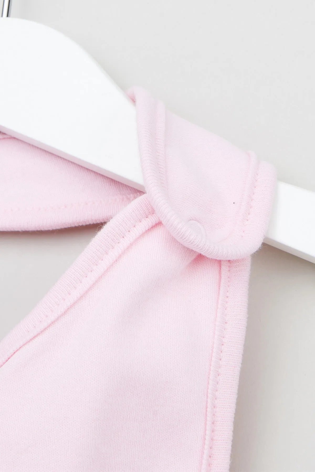 Pink baby bib neck strap with soft ribbed trim and side seam