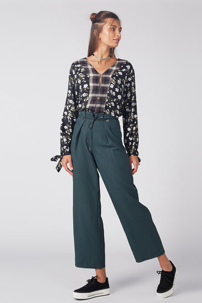 Teal wide-leg pants with relaxed drape, drawstring waist, and side pockets