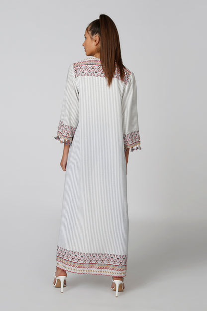 Long striped caftan dress with multicolor embroidered cuff and hem trim, side view