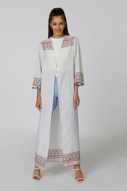 Long striped caftan dress with multicolor embroidered trim at hem and cuffs
