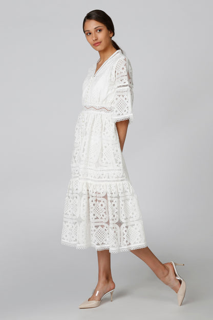White lace tiered midi dress with V-neck, ruffled hem, and 3/4 bell sleeves