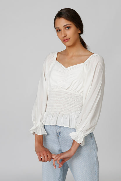 White peasant blouse with long puff sleeves and square neckline, smocked waist