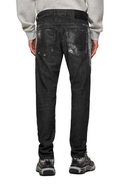 Men's black distressed jeans back view with multiple utility pockets
