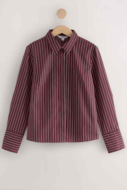 Wine striped button-up shirt on hanger with long sleeves and pointed collar
