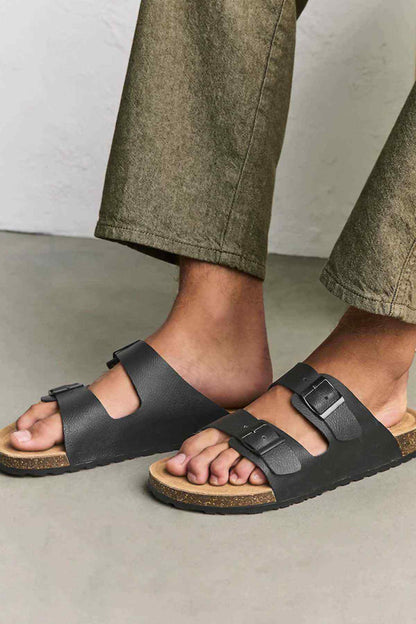 Black leather-look double-strap slide sandals with adjustable buckle straps