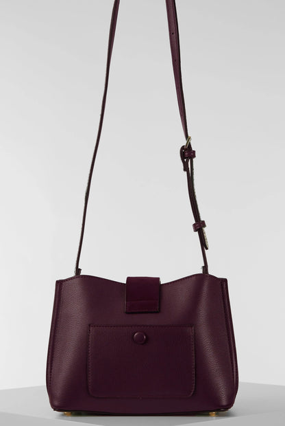 Purple shoulder bag with square front pocket and adjustable crossbody straps