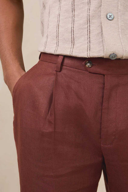 Men's brown suit trousers with belt loops, front pleats, and buttoned waistband