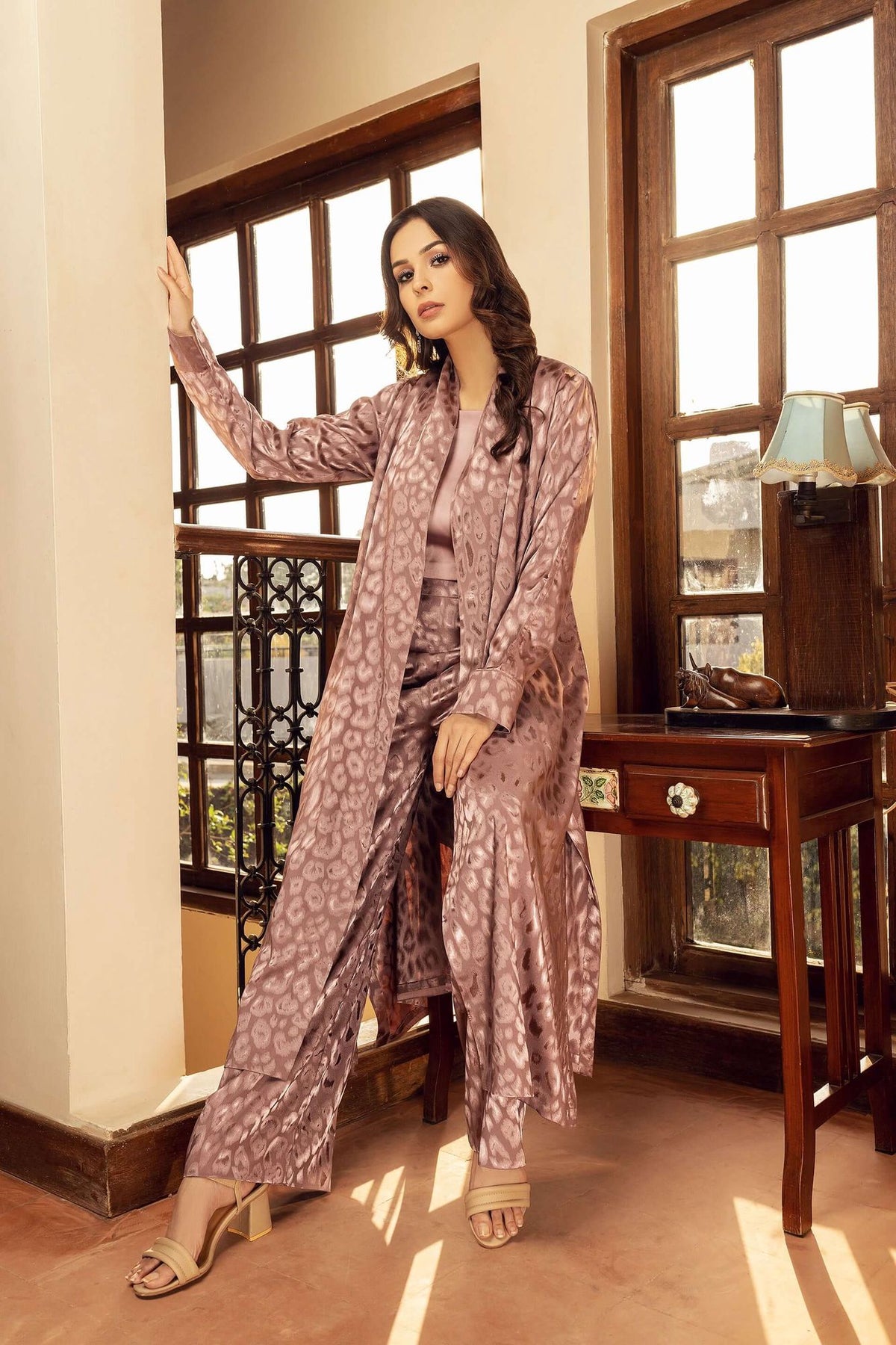 Lilac velour robe with allover animal print, relaxed fit, long length, open front.