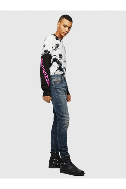 Blue wash denim jeans with tapered fit on model