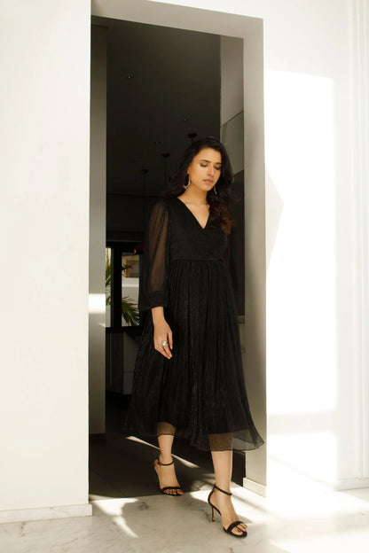 Black V-neck midi dress with long sleeves and pleated A-line skirt