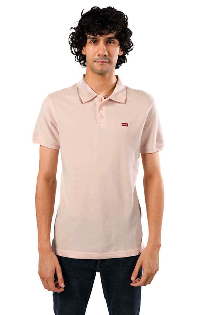 Pink polo shirt front view with collar buttons and small chest logo