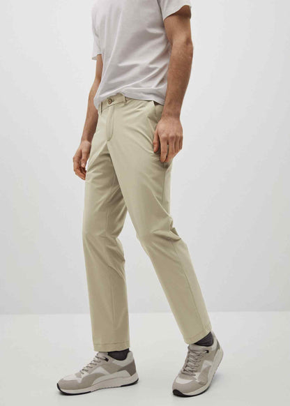 Beige chino pants with button fly, belt loops and slanted pockets