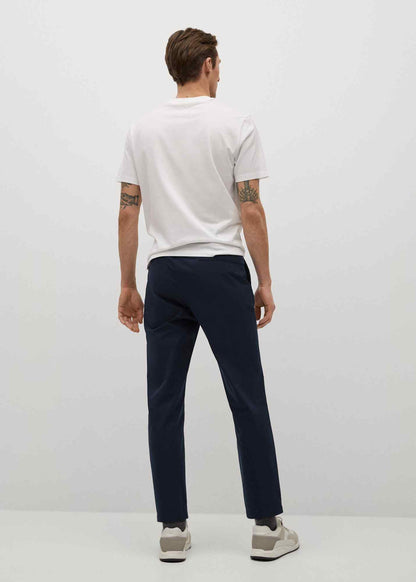 Dark navy tapered trousers with belt loops and zip fly, rear view