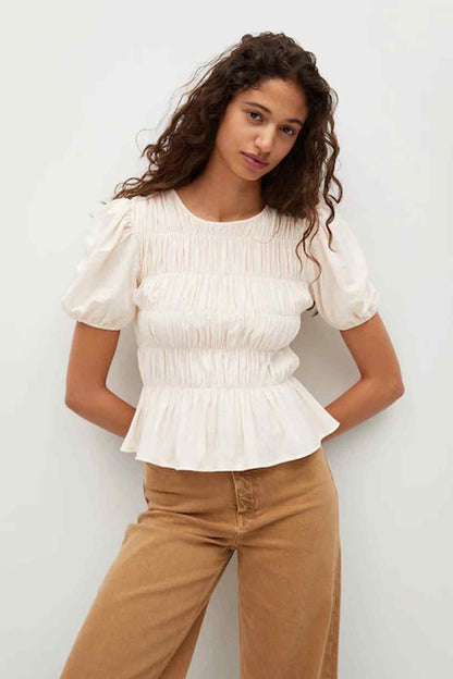 Vanilla peplum blouse with puff sleeves and smocked waist