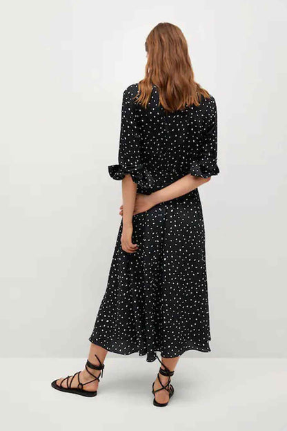 Back view of black speckled midi dress with half sleeves and waist tie