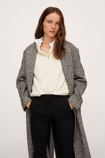 Black ankle-length slim pants with zip fly and front pockets