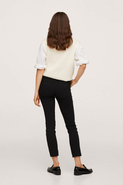 Black slim ankle pants with back yoke and belt loops