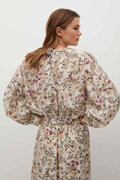 Ecru floral maxi dress with long puff sleeves, gathered waist, tiered back