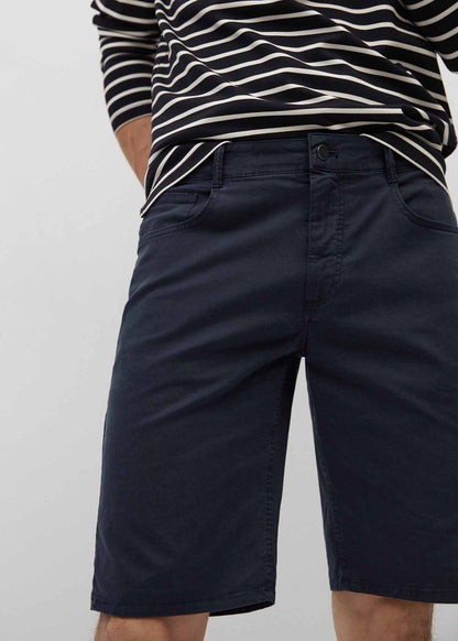 Dark navy denim shorts close-up, zip fly, front pockets