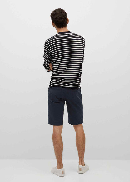 Dark navy denim shorts with belt loops, mid-thigh length, back view