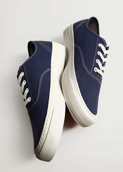 MANGO blue low-top sneakers, side view, white sole and lace-up with eyelets