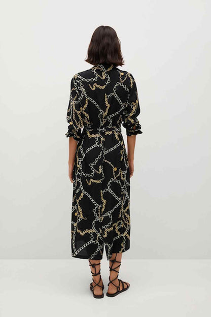 Black chain-pattern midi dress, back view, belted waist, elbow-length sleeves