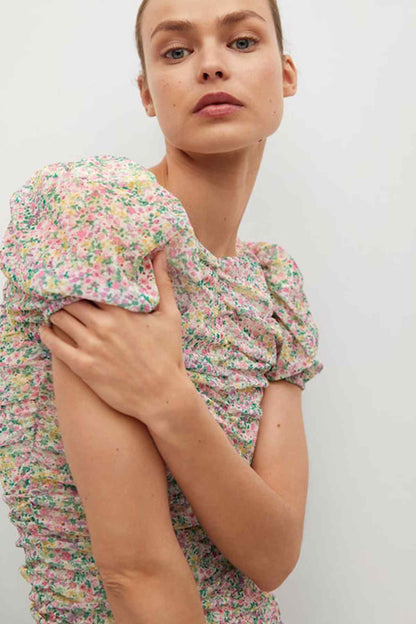 Pastel pink floral mini dress detail view of short puff sleeves and gathered bodice