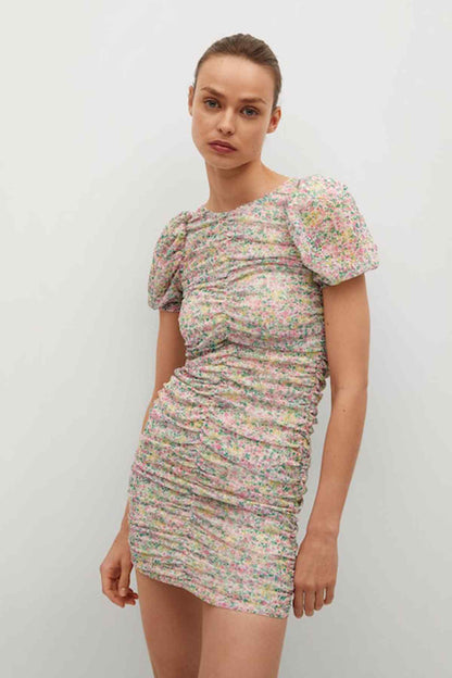 Pastel pink floral mini dress with short puff sleeves and ruched waist