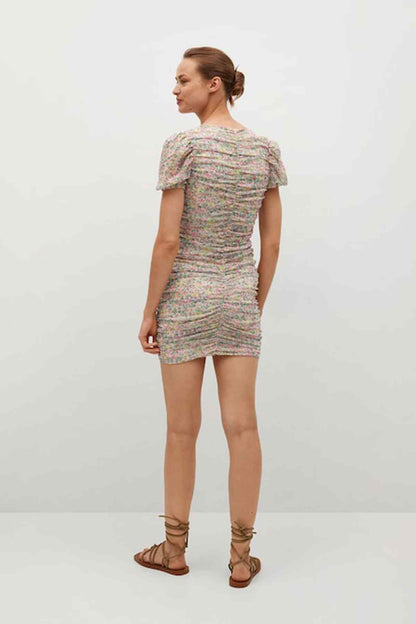 Pastel pink floral mini dress, back view with short puff sleeves