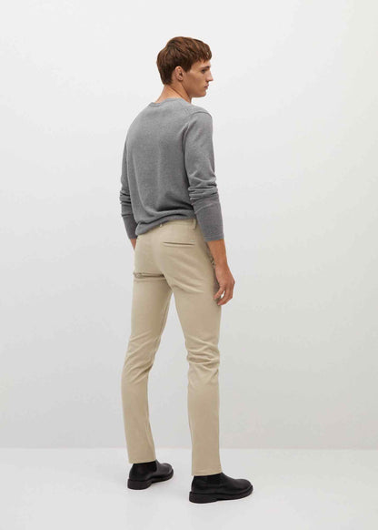 Beige chino trousers, side view with belt loops and slim tapered leg