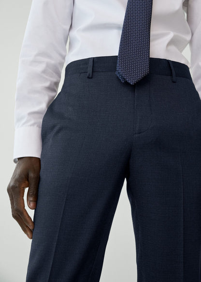 Night blue suit trousers close-up showing waistband, belt loops, and side pocket