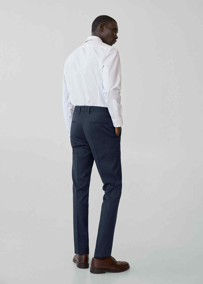 Night blue suit trousers with pressed front pleat and cuffed hem, side view