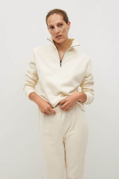 Ecru quarter-zip sweatshirt and drawstring jogger pants