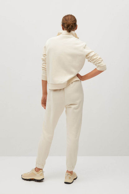Ecru quarter-zip sweatshirt and jogger pants, back view