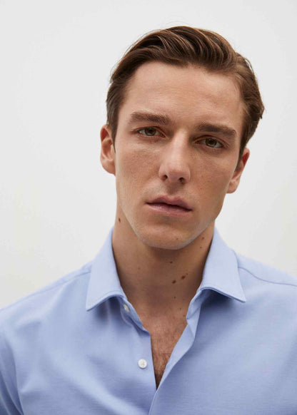 Sky-blue button-up shirt, open collar detail, long sleeves, front close-up