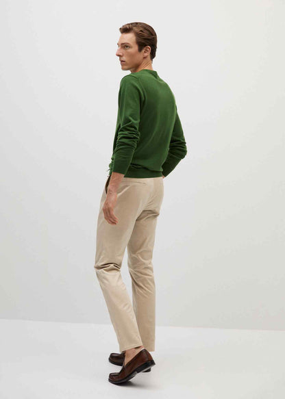 Beige trousers, side view with tapered fit and belt loops